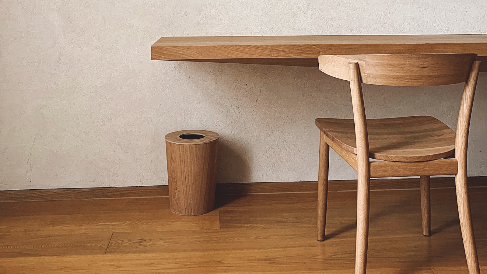 Two upholstered bar stools tucked under a kitchen island counter in a bright, welcoming kitchen.