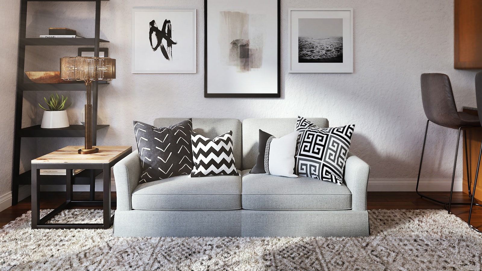 An elegant, neutral living room that looks high-end through styling, lighting, and tidy edited surfaces.